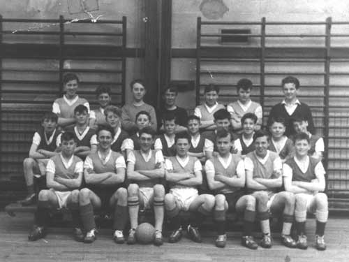 Ian Scott with pupils in the gym